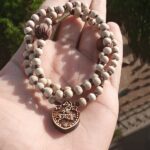 Shri Krishna Tulsi Locket With Round Shaped Beads Mala Deity Name Shri Krishna Material Tulsi Bead Shape Spherical Bead Size 5 Mm Mala Length 20 Inches