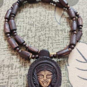Kali Maa Beautifully Carved Tulsi Locket Mala Disclaimer : Product’s color may slightly vary due to photographic lighting sources or your monitor settings. Precaution : This Tulsi bead is brittle, handle with care Instruction : If you put Tulsi Beads in water the color may change. Note : Descriptions for products are taken from scriptures and oral tradition