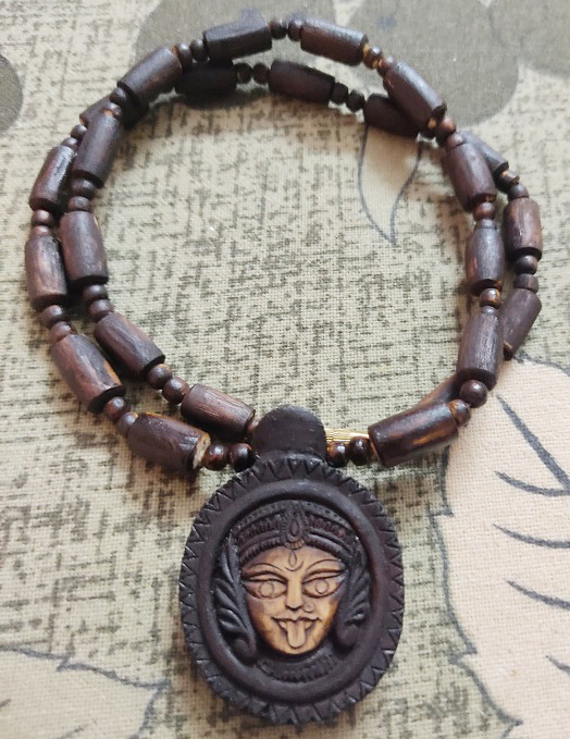 kali-maa Kali Maa Beautifully Carved Tulsi Locket Mala Disclaimer : Product’s color may slightly vary due to photographic lighting sources or your monitor settings. Precaution : This Tulsi bead is brittle, handle with care Instruction : If you put Tulsi Beads in water the color may change. Note : Descriptions for products are taken from scriptures and oral tradition